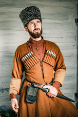 Caucasian man Circassian Adyg highlander in national dress. A large portrait of a bearded horseman...