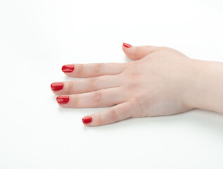 Soft focus on female hand with nail polish.