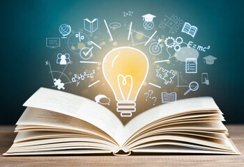 open book and holographic light bulb with education icons, concept of learning