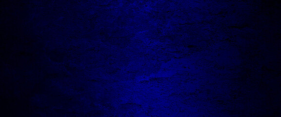 Blue abstract lava stone texture background, dark blue rough grainy stone or concrete wall texture background, Blue background with faint texture and bright center and black vignette border.