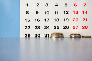 The Money on the background of the calendar.The concept of repayment of a loan,installment...
