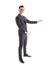 Asian businessman wearing black suit standing over white background