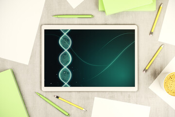 Creative light DNA illustration on modern digital tablet display, science and biology concept. Top view. 3D Rendering