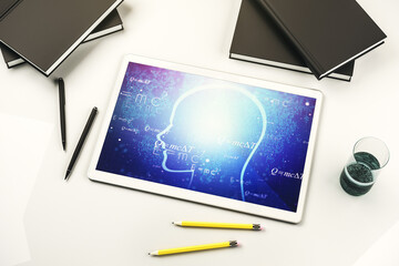 Creative artificial Intelligence concept with human head sketch on modern digital tablet display. Top view. 3D Rendering