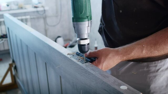 a professional male master is installing doors in an apartment.