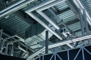 Air conditioning, ventilation ducts and heating pipes of buildings. Industrial background