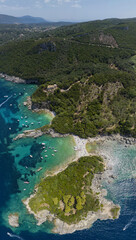 Fototapeta na wymiar Aerial view of Limni Beach Glyko, on the island of Corfu. Greece. Where the two beaches are connected to the mainland providing a wonderful scenery. Unique double beach. Kerkyra 