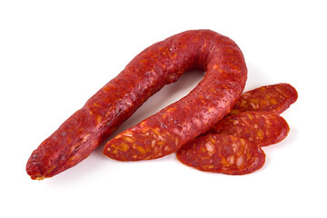 Chorizo sausage, thin cut. Spanish salami, close-up, isolated on white background.