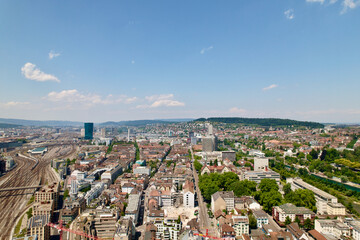 Naklejka premium Aerial view of cityscape of City a sunny with local mountain in the background summer day. Photo taken June 20th, 2022, Zurich, Switzerland.