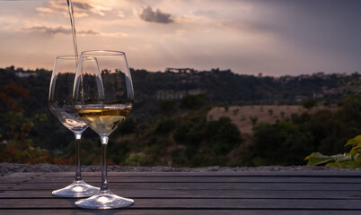 Image overlay of a wine glass & bottle, and white grapes  - background, concept