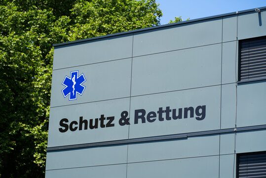 Blue logo with aeskulap of civil rescue and protection (German Schutz und Rettung) organization of City of Z&uuml;rich on a sunny summer day. Photo taken June 20th, 2022, Zurich, Switzerland.