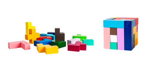 Chaos vs order concept. Multicolored puzzle toy elements and blocks arranged in cube isolated on white background. Wooden kids game for logical thinking development. High quality photo