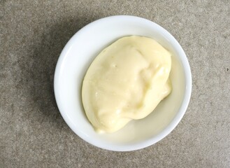 Mayonnaise sauce on gray background