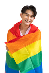 Portrait of cute Asian LGBT homosexual men or gay standing and smiling, covered with pride rainbow flag, on white background. Looking at camera.