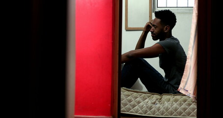 Fototapeta na wymiar Frustrated black man feeling anxiety. Anxious Candid African person in depression
