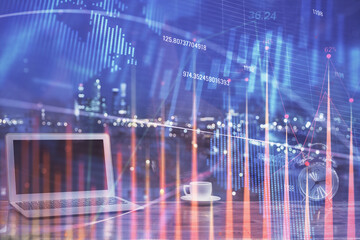 Stock market graph and table with computer background. Multi exposure. Concept of financial analysis.