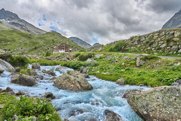 nice active senior woman riding her electric mountain bike in the silvretta mountain range near Gaschurn, Tyrol, Austria