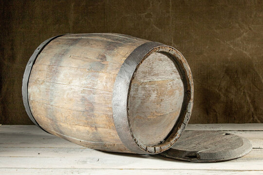 An Old Oak Wine Barrel Lying On Its Side