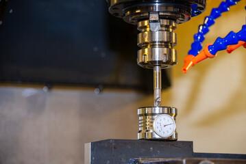 The tool length measurement with dial gauge on CNC milling machine.