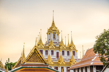 Fototapeta premium Beautiful architect of buddhist templae sunset sky with cloud