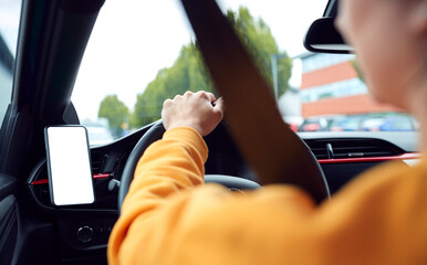 Close Up Of Driver With Hands Free Unit For Green Screen Mobile Phone Mounted On Dashboard