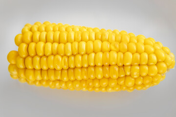 view of delicious juicy yellow boiled corn on a white background. Healthy cereals in the diet every day. The benefits of plant vitamins.