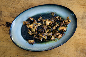 Delicious bulgarian snails in black sauce