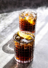 Cooling Long Island iced tea with lemon and ice cubes