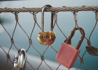 padlocks with initials hanging on a rope