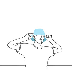 man puts panama on his head - one line drawing vector. concept protect head from sun blow, headwear for summer, summer accessory