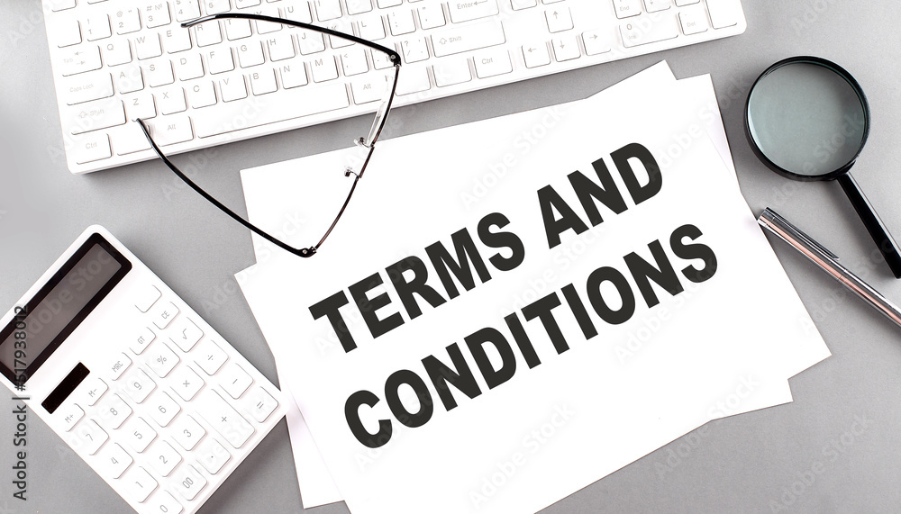 Poster terms and conditions text on paper with keyboard, calculator on grey background