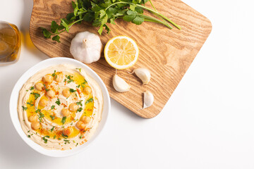 Delicious hummus with chickpeas, olive oil, lemon and pita bread. Vegetarian food concept.