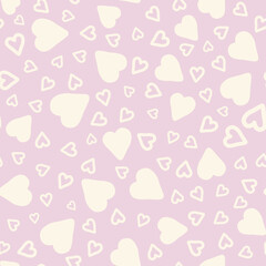 Cream pastel hearts over light pink background