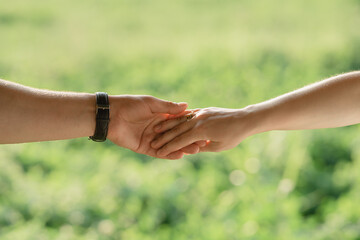 close up of hands holding each other