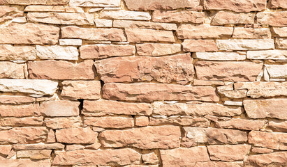 Old brick wall. Background of terracotta stones.