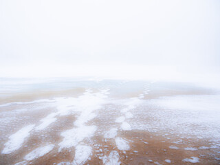 Snow melt on an ice covered pond