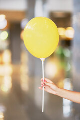 Yellow ball close-up. Balloon on a blurred background 
