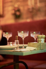 Glasses with drinks in a dimly lit restaurant 