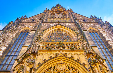 Gothic styled main facade of Cathedral of Saints Peter and Paul with stone decorations, Brno, Czech...