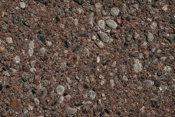 Tarmac brown grainy and rocky road. Texture background. Top view