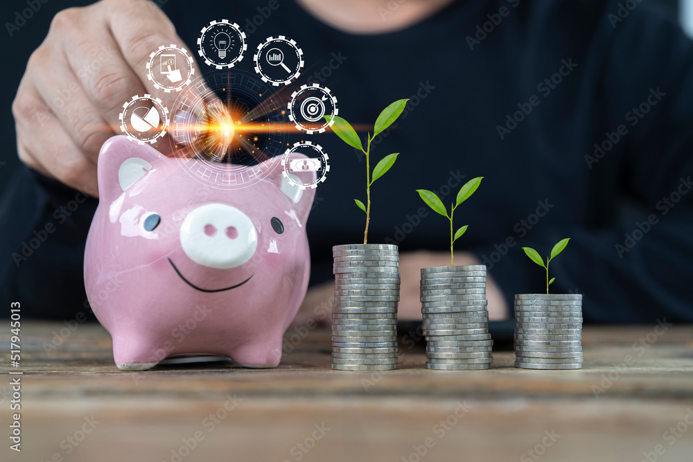 Poster saving ideas and saving money. a sapling or a small tree planted on a pile of coins