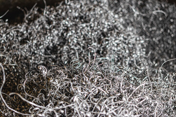Metal shavings. Background. Waste after metal processing on a lathe.