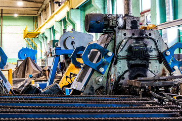 Machine for induction heating of metal. A metal rod heated in an induction furnace. Hot metal...