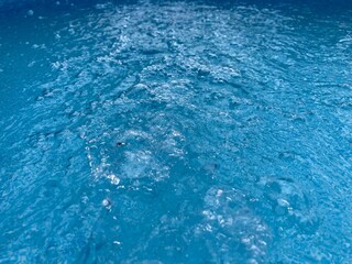 a water current in a blue swimming pool