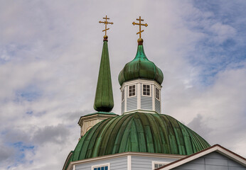 Green roof structure and exterior of the restored Orthodox cathedral in Sitka in Alaska - obrazy, fototapety, plakaty