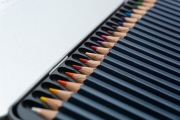 Various colored pencils on a white background