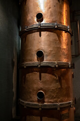 Old and modern equipment for distillation of strong alcoholic apple drink calvados in Normandy, Calvados region, France