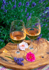 French rose wine from Provence, two glasses of wine with purple lavender flowers on background