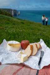 Lunch with french round camembert cow cheese from Calvados region, fresh baked baguette bread and...