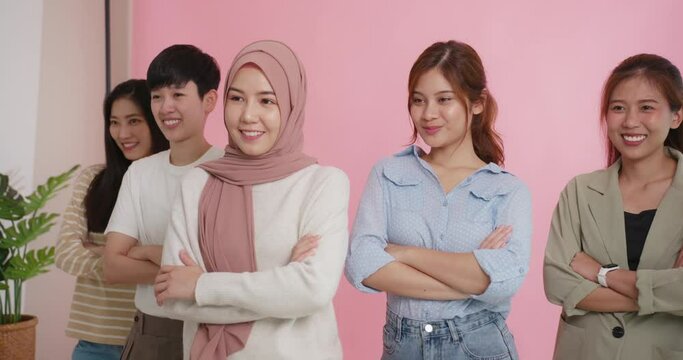 Diverse Group Of Young Asia Gen Z Girl Arm Cross Happy Face Look At Camera In Model Shooting Studio Shot. Power Of People Woman's Day Right Or Gay Youth LGBT Pride Unity Team Strong Cool Proud Smile.